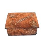 An Arts and Crafts beaten Copper slipper box