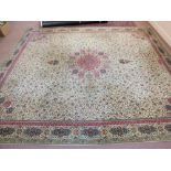 A machine made Persian style brown ground carpet with repeating central design,