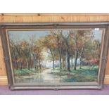 A signed oil on canvas of an autumn woodland scene, signature indistinct,