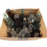 A quantity of glass bottles including some banded and local ones