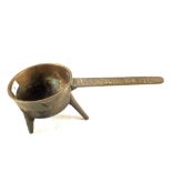 An 18th Century Bronze skillet, the handle marked 'Washbrough 2' on three legs,