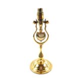 An early 20th Century Brass ships table lamp with gimbal, having heart decoration,