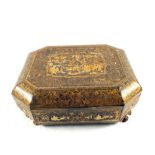 A 19th Century Chinese export lacquer workbox with lidded containers and trays,