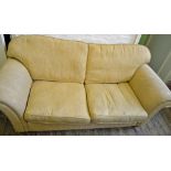 A yellow three seater sofa