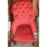 A lady's red upholstered bedroom chair