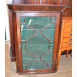 A Mahogany astral glazed hanging corner cupboard