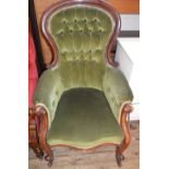 A Victorian button back armchair