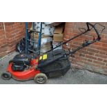 A Champion petrol lawn mower