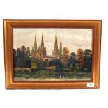 A George William Pryce oil on card of a Autumnal river scene with a Cathedral in the back ground,