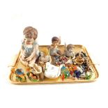 Four porcelain children and animal ornaments etc