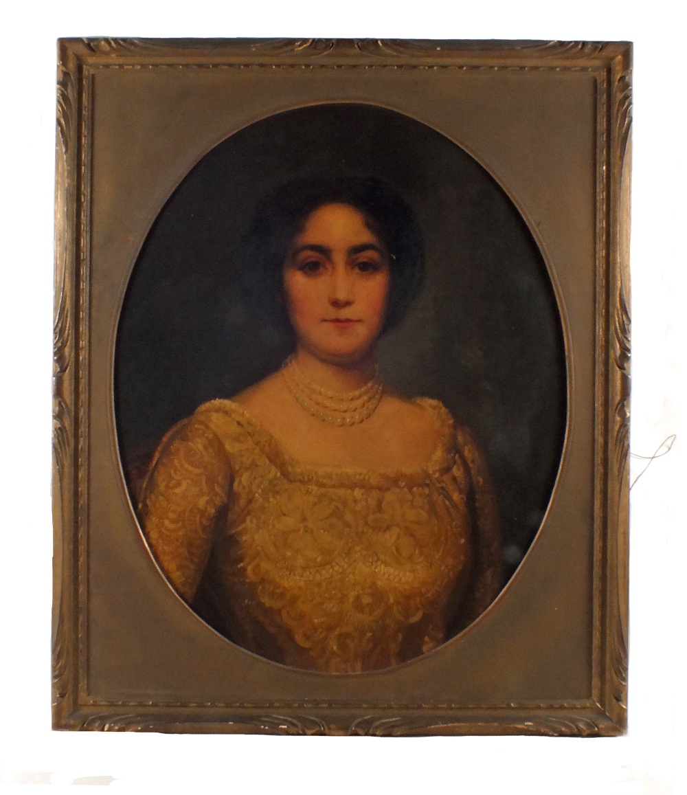 Unsigned oil on canvas laid to board, three quarter length oval portrait of a Lady,