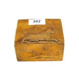 A Brass cigarette box with engraved and relief dog decoration