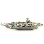 A plastic aircraft carrier and twenty four die cast planes