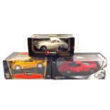 Two boxed Burago and one Hot Wheels car