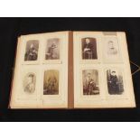 A Victorian photograph album with a quantity of photographs