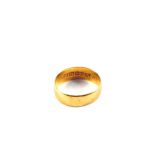 A 22ct Gold wedding band,