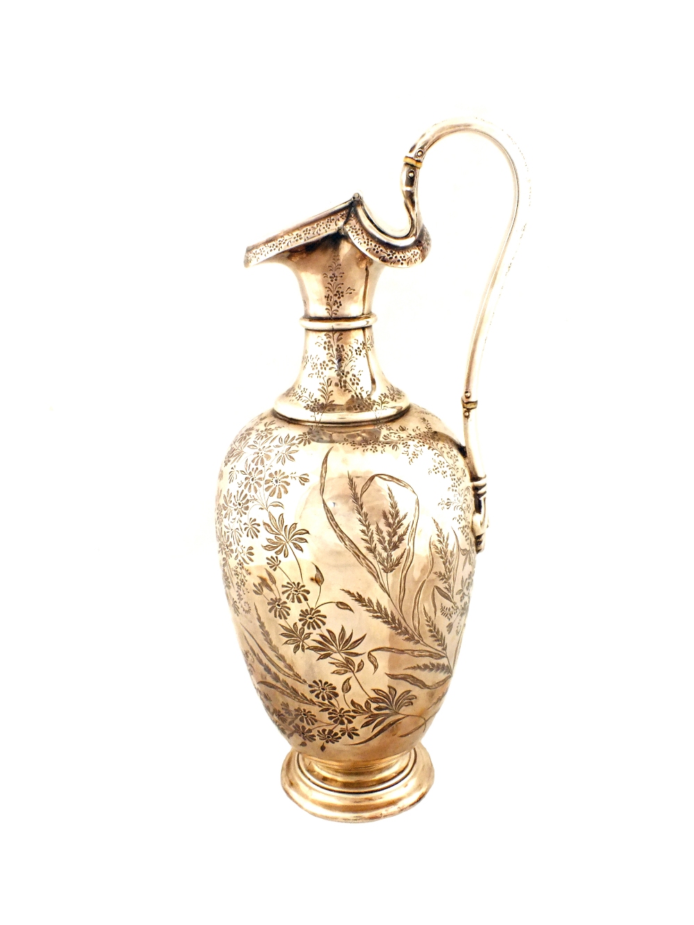A Silver hot water jug with floral engraving,