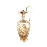 A Silver hot water jug with floral engraving,
