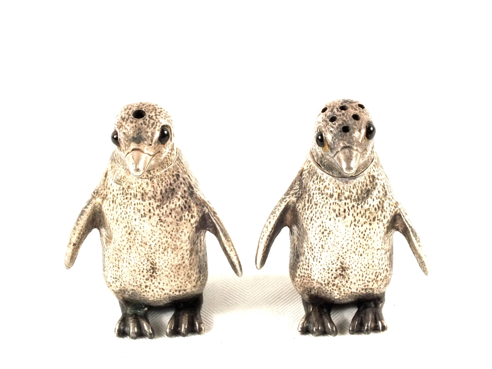 A pair of Silver Penguin salt and peppers,