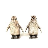 A pair of Silver Penguin salt and peppers,