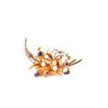 A 9ct Gold floral spray brooch with Seed Pearls and Amethyst stones