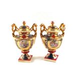 A pair of Vienna lidded urns (one damaged)