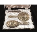 A cased Silver brush and mirror set,