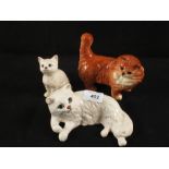 Two Beswick Cats (one repaired) and a Royal Doulton Cat