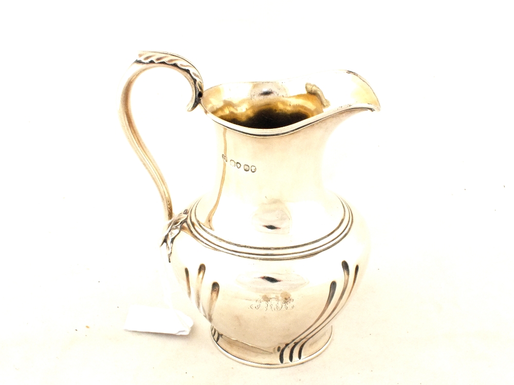 A Silver water jug,