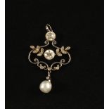 A Diamond and Pearl pendant consisting of two large central set Diamonds (approx 2ct total Diamond