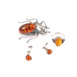 Three pieces of Silver and Amber jewellery to include a large Beetle brooch