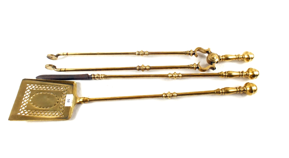 A fine set of three Georgian Brass fire irons with knopped handles and shafts,