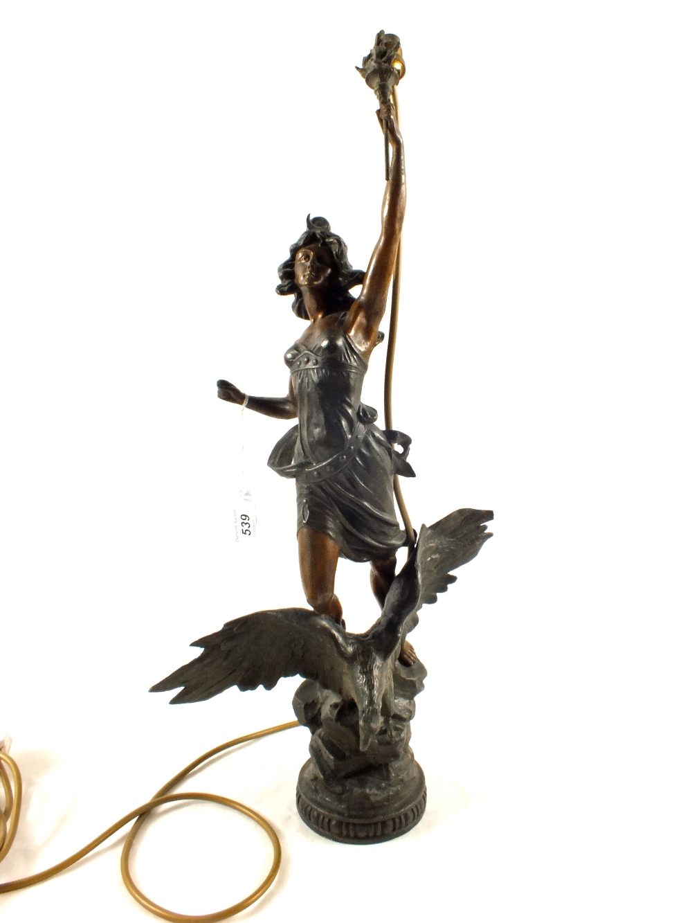 A French spelter table lamp of a lady with torch on eagle