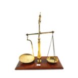 A pair of early Victorian Brass shop scales with wooden base, makers Bartlett,