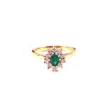 An 18ct Gold Emerald and Diamond cluster ring,