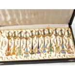 A cased set of eleven Norwegian Silver and multi coloured enamel coffee spoons by J.