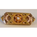 A Victorian bar brooch, set with seed pearls in a floral pattern, with a plain pin back, yellow