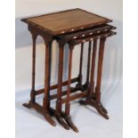 A nest of three late 19thC mahogany tables, each with moulded outlines on stylized bamboo