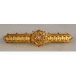 A Victorian bar brooch, florally set with central seed pearl with canetille work with plain pin