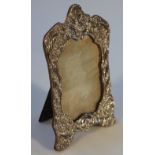 A Victorian silver photograph frame, by William Neal & Sons, of shaped form rococo decorated with