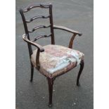 A 19thC mahogany Chippendale design ladderback chair, with a scroll top rail, above pierced comb