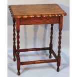 A 1920s oak sewing table, the rectangular pie crust top hinging to reveal a plain well, on barley