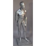 A plaster figure of a standing nude gentleman, on a plain rectangular base overall decorated in