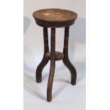A late 19thC poker work stool, the circular top decorated with fruit with an outer gadrooned