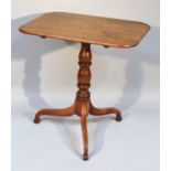 A 19thC oak occasional table, the oblong top raised on a baluster column, terminating in triple