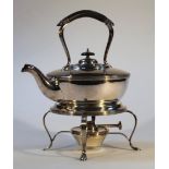 An early 20thC silver plated spirit kettle, with ebonised handle, shaped spout and bulbous body
