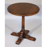 A 20thC Old Charm style coffee table, the circular top raised on a cylindrical column terminating in