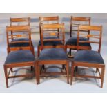 A set of six George III mahogany dining chairs, each with curved top rails and central 'X' splats