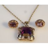 An amethyst jewellery set, comprising a pendant , set with central stone, attached to a slender link
