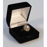 A ladies cluster dress ring, multi layered cubic zirconium, yellow metal shank, marks rubbed,